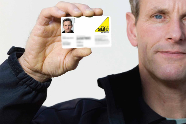gas engineer holding a gas safe card gas engineer holding a gas safe card